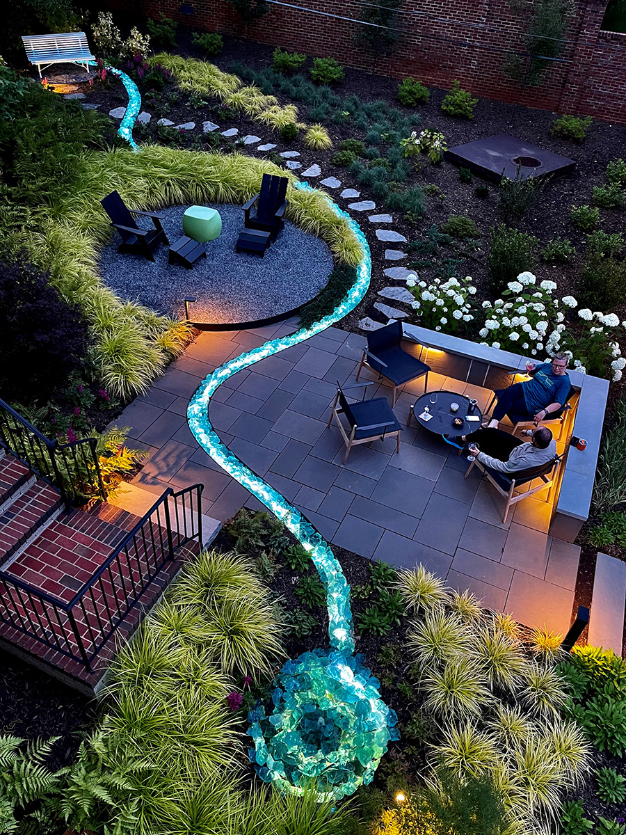 overhead view of garden at dusk with creative blue lighting